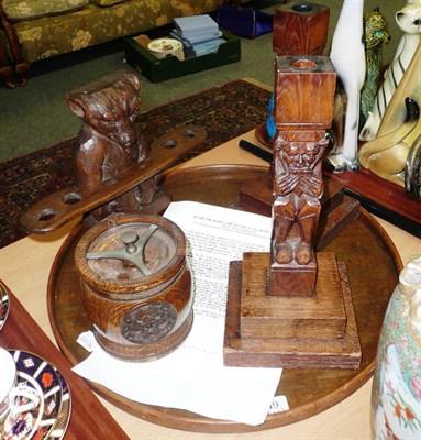 Lot 249 - Circular tray, pair of carved candlesticks, carved winged figure with letter, a walking stick and a