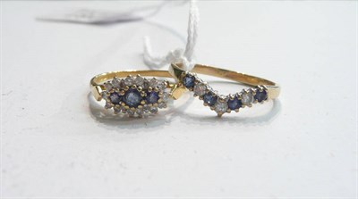 Lot 281 - An 18ct gold sapphire and diamond cluster ring and a 9ct gold wishbone ring