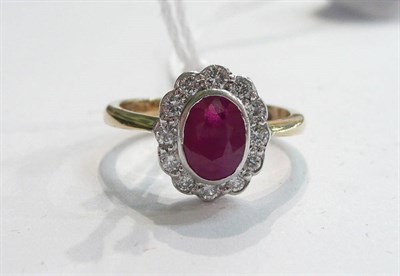 Lot 282 - A 9ct gold ruby and diamond cluster ring