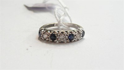 Lot 295 - An 18ct white gold sapphire and diamond ring