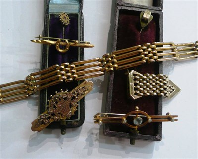 Lot 318 - A gate bracelet, assorted brooches and four stick pins