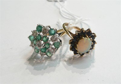 Lot 343 - An emerald and diamond cluster ring and an opal and sapphire cluster ring