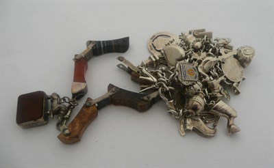 Lot 354 - A white metal charm bracelet and charms and a hardstone brooch (a.f.)