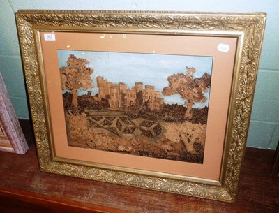 Lot 383 - A late Victorian cork picture of  Hawarden Castle, shown between two trees with formal gardens...