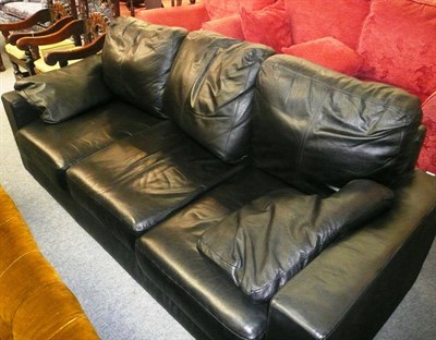 Lot 470 - Black leather three seater settee
