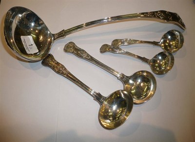 Lot 1 - A large silver shell pattern ladle and two similar pairs of smaller ladles, 18oz