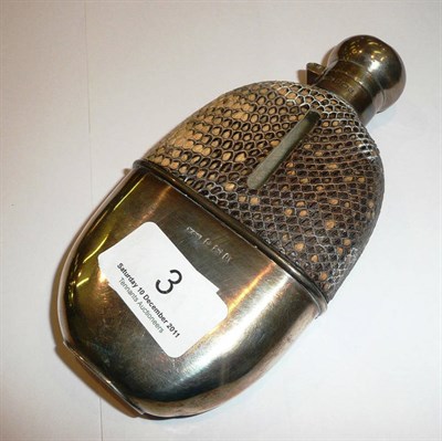 Lot 3 - A silver mounted hip flask with snakeskin-style mounts and pull-off cup