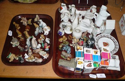 Lot 32 - A collection of crested china and Wade whimsies on two trays