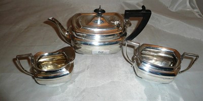 Lot 52 - Three piece silver 'bachelor' tea set with ebonised handles, 17oz