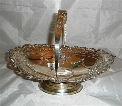 Lot 55 - A silver swing-handled basket with pierced decoration, 18oz