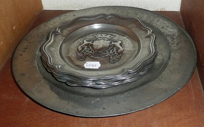 Lot 82 - Five pewter plates with armorial device and two pewter chargers