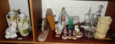 Lot 83 - An Art Deco clock, pot lid, four Goebel figures etc on two shelves