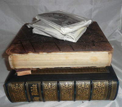 Lot 84 - A Victorian leather-bound photograph album, an unframed sampler, postcards, etc