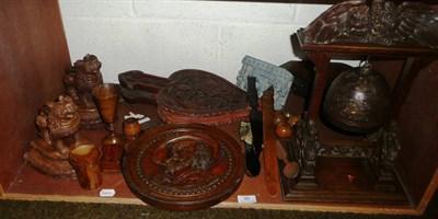 Lot 88 - A shelf of assorted treen including carved bellows, table gong, wall bracket etc