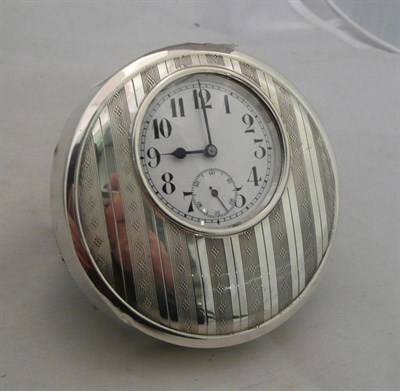 Lot 91 - An Art Deco silver strut clock with engine turned decoration