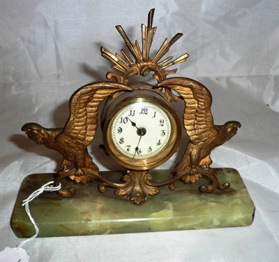 Lot 93 - Gilt clock on onyx base