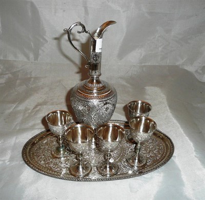 Lot 111 - Persian white metal decanter, five goblets and tray