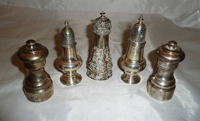 Lot 114 - Three small silver sugar castors and a pair of silver salt and pepper grinders