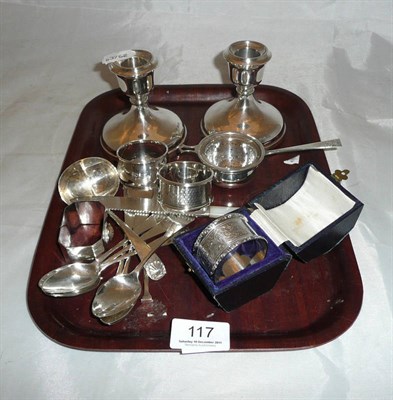 Lot 117 - A pair of dwarf silver candlesticks, cased silver napkin rings, three others, teaspoons, a strainer