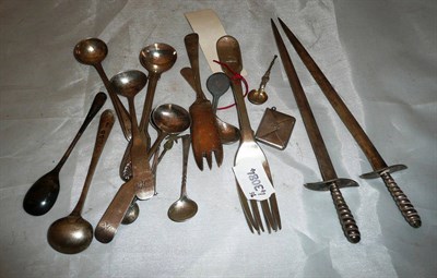 Lot 119 - Various silver mustard and salt spoons, a pair of sword letter openers etc