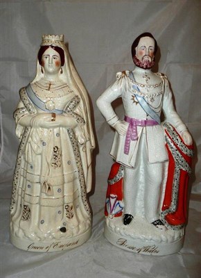 Lot 131 - A large pair of Staffordshire figures of Queen Victoria and Prince Albert