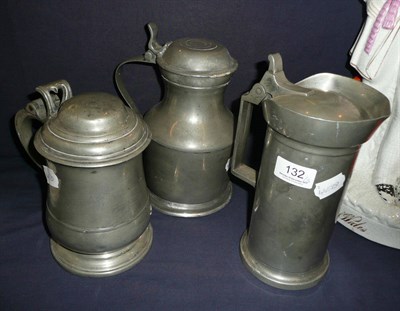 Lot 132 - A pewter tankard with pierced heart knop and two other tankards