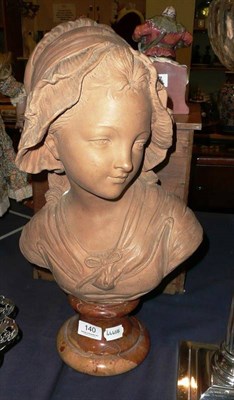 Lot 140 - An Italian ceramic bust of a young girl on a marble base