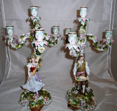 Lot 143 - A pair of Sitzendorf three branch candelabrum