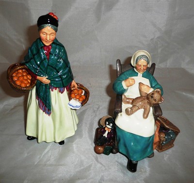 Lot 147 - Two Royal Doulton china figures, 'The Orange Lady' and 'Nanny'