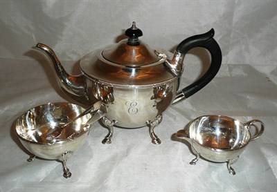 Lot 163 - A three piece silver tea service with a pair of sugar tongs, 26oz