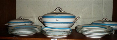 Lot 189 - A part dinner service decorated with turquoise blue bands and highlighted in gilt, each with a...