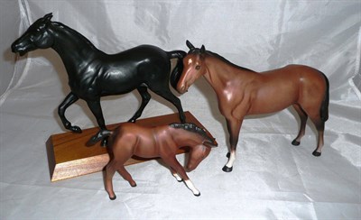 Lot 228 - A Beswick horse, a black horse on wooden base and a Doulton horse