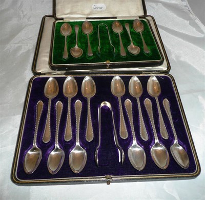 Lot 244 - Cased set of twelve silver teaspoons and tongs and set of six silver teaspoons and tongs, 8oz