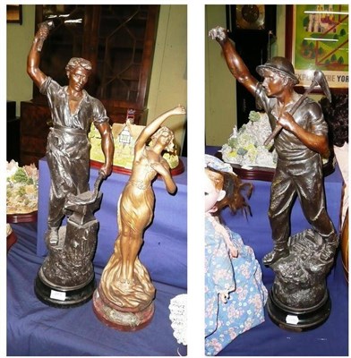 Lot 273 - A large pair of spelter figures of industrial workers and another of a woman