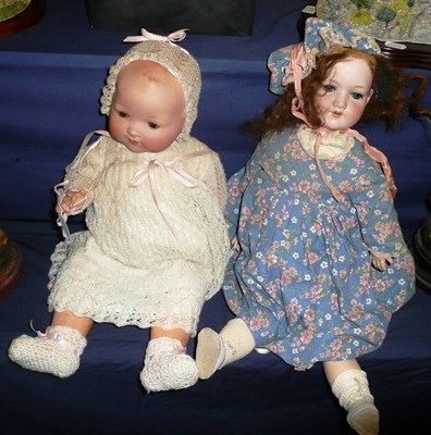 Lot 274 - Armand Marseille 390 bisque socket head doll in a blue floral dress and a baby doll (2)