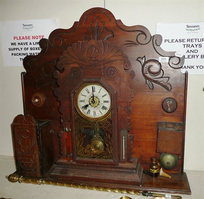 Lot 285 - A 19th century American shelf clock with storm glass thermometer, acid battery and bell