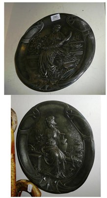 Lot 290 - A pair of Art Nouveau pewter dishes depicting maidens at rest, numbered '281' and '281A'