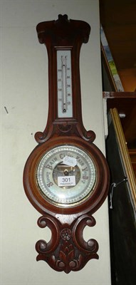 Lot 301 - Carved oak aneroid barometer