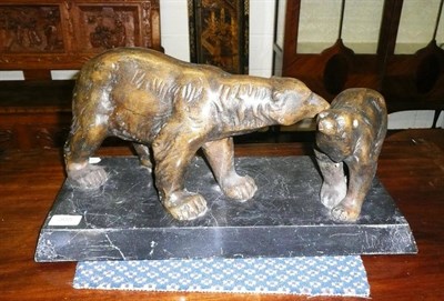 Lot 305 - An Art Deco model of a polar bear and cub mounted on a marble base, signed