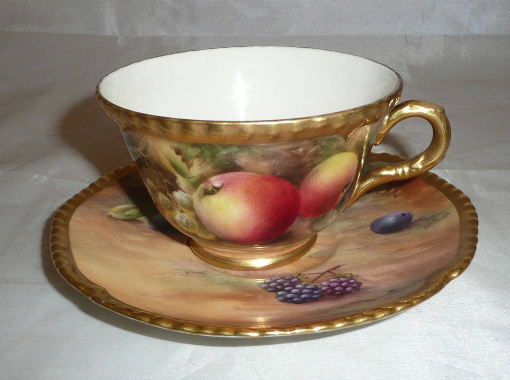 Lot 313 - A Royal Worcester cup and saucer painted with fruit, saucer signed 'H Price', the cup signed 'P...