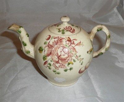 Lot 325 - An 18th century creamware teapot and cover, possibly Cockpit Hill (restored)