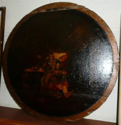 Lot 372 - A naive circular painted wooden panel depicting an interior scene