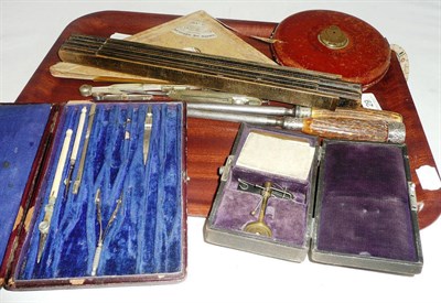 Lot 29 - Mixed instruments including a cased yarn balance, cased drawing instruments, Rabone tape,...