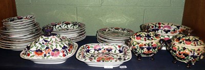 Lot 73 - A quantity of 19th century pottery dinner wares (a.f.) on a shelf