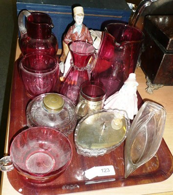 Lot 123 - Tray of assorted cranberry glassware, Royal Doulton figure Lily, glass inkwell, figure of a...