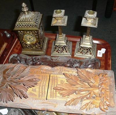 Lot 128 - Brass pierced clock garniture and two carved folding book stands