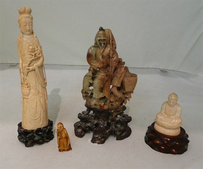 Lot 144 - Chinese ivory figure of Guanyin and a Japanese Buddha (both with wooden stands), a small figure and