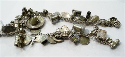 Lot 186 - A double silver charm bracelet