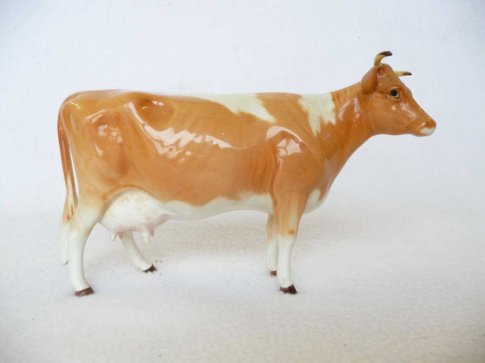 Lot 1074 - Beswick Guernsey Cow, model No. 1248A (first version-horns and ears apart), tan/brown and...