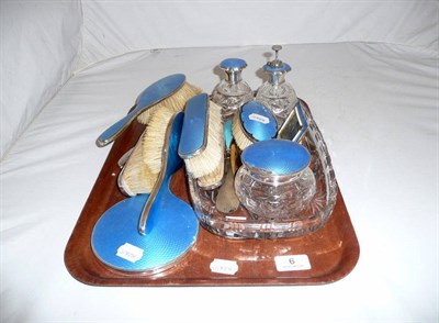 Lot 6 - A silver and blue guilloche enamel composite dressing table set of seventeen pieces and a glass...